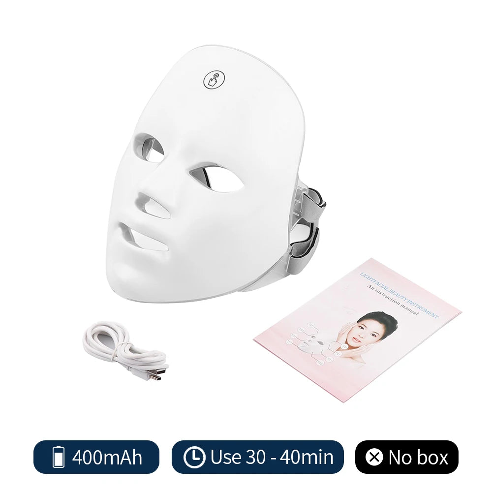 White LED face mask with charging cable and user manual on a white background