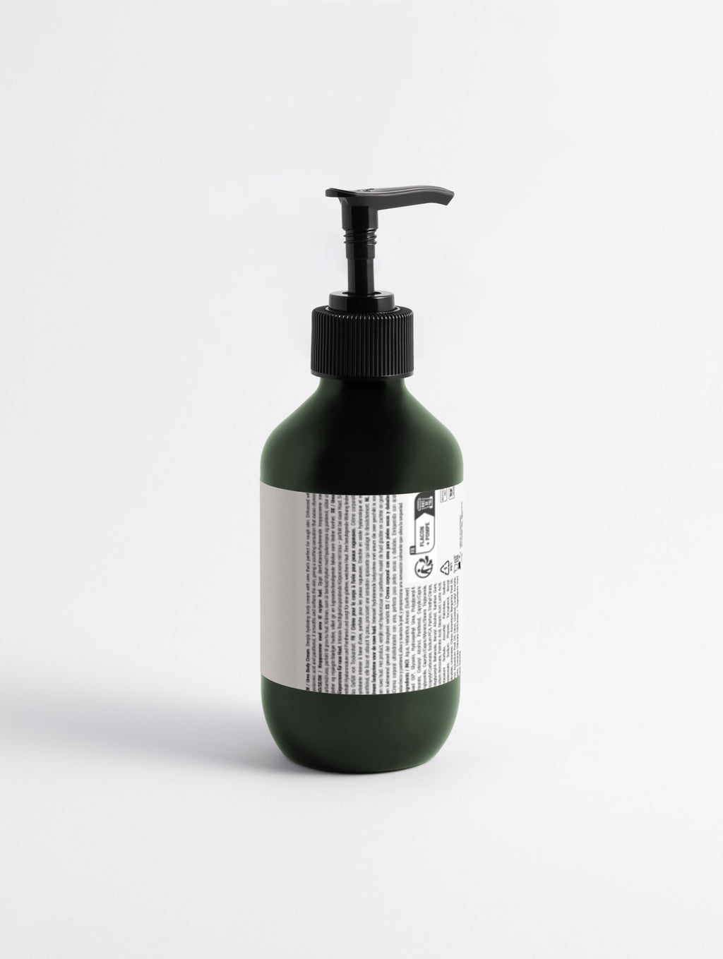 Green bottle with pump and label on a white background